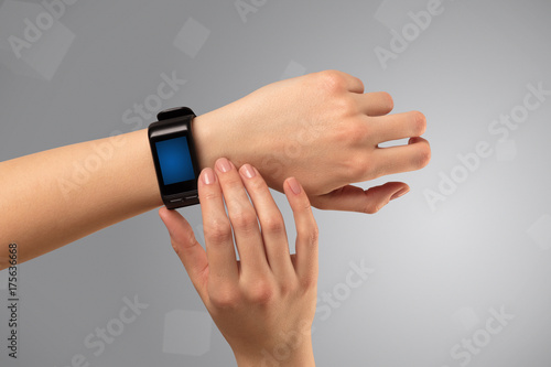 Female hand wearing smartwatch