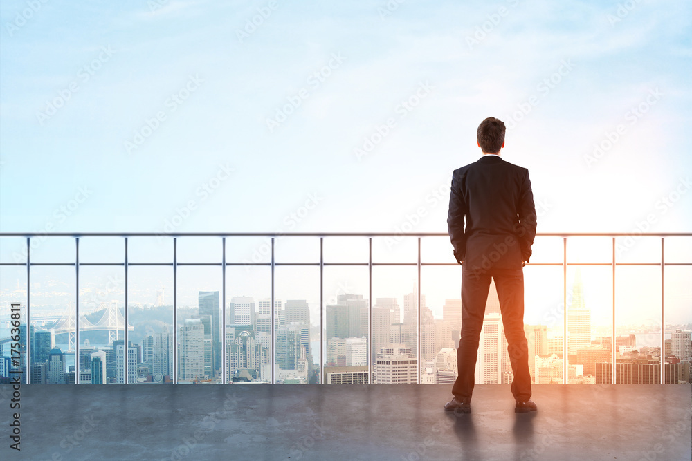 Fototapeta premium Businessman on rooftop
