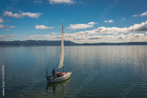 sailboat fishing calm bay