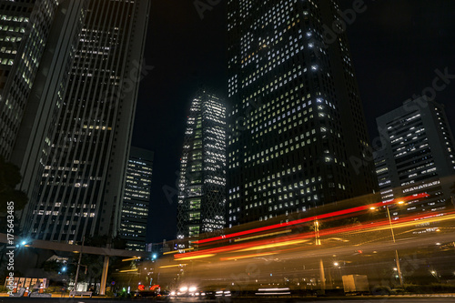 The Current of Cars With Tall Buildings In the Night of Shinjuku: The Night Scene of Tokyo