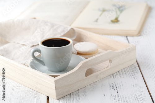 details of living room. Cup of coffee on rustic wooden tray