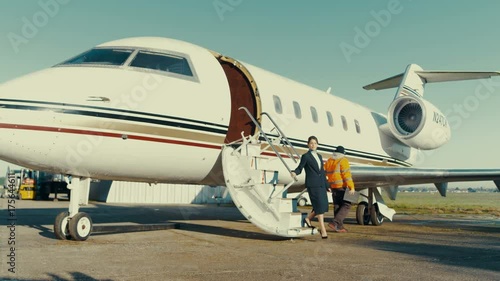  Middle Eastern VIP businessman disembarking from private jet photo