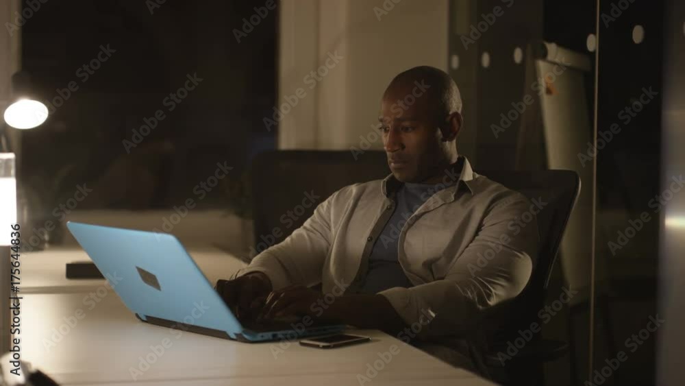 Tired businessman working late at the office Tired businessman working late at the office