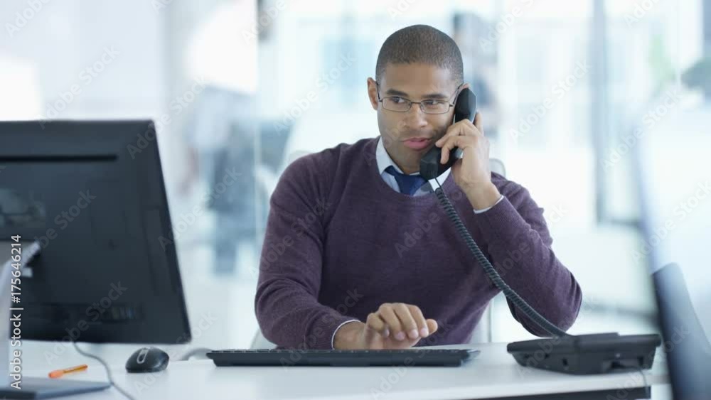 Portrait smiling businessman working at his desk in modern office Portrait smiling businessman working at his desk in modern office