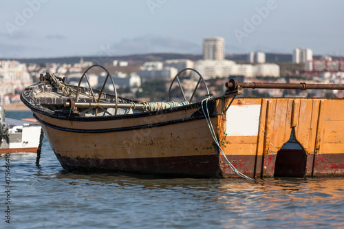 small old fishing boats on the tajo river near lisbon portugal