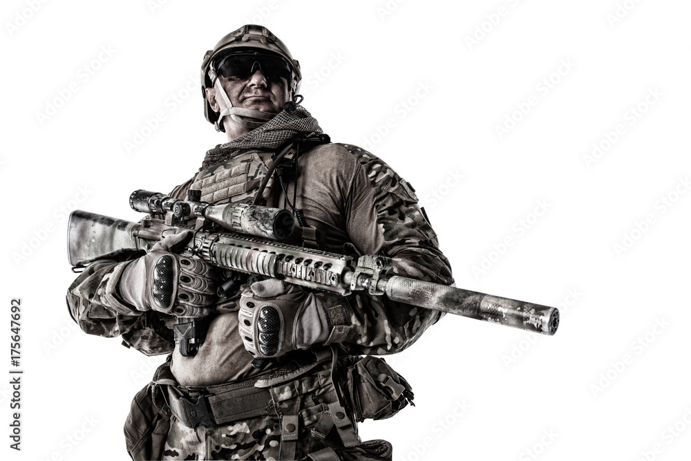 Half length cropped studio shot of big muscular soldier in field uniforms with sniper rifle, portrait isolated on white background lot of copyspace. Protective goggles glasses are on Half length cropped studio shot of big muscular soldier in field uniforms with sniper rifle, portrait isolated on white background lot of copyspace. Protective goggles glasses are on