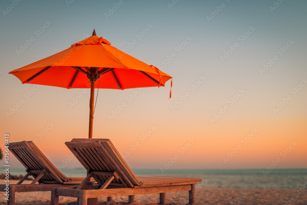 Beautiful beach. Chairs on the sandy beach near the sea. Summer holiday and vacation concept. Inspirational tropical scene. Tranquil scenery, relaxing tropical landscape design