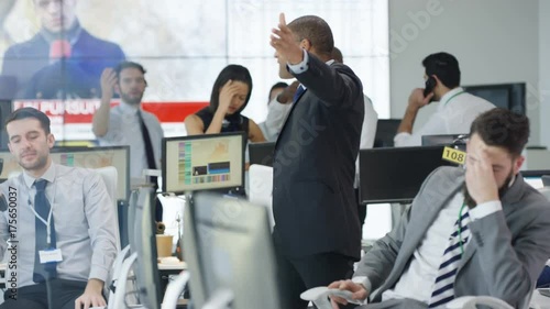  Financial traders watching the world markets react as the market crashes