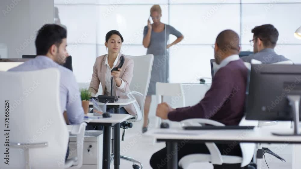 Business team including pregnant woman working together in office Business team including pregnant woman working together in office