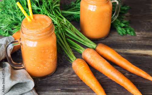 Fresh carrot smoothie in jars