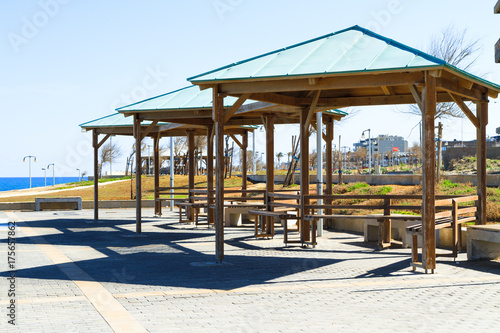 Wooden gazebo pergola playground recreation area at seaside public park