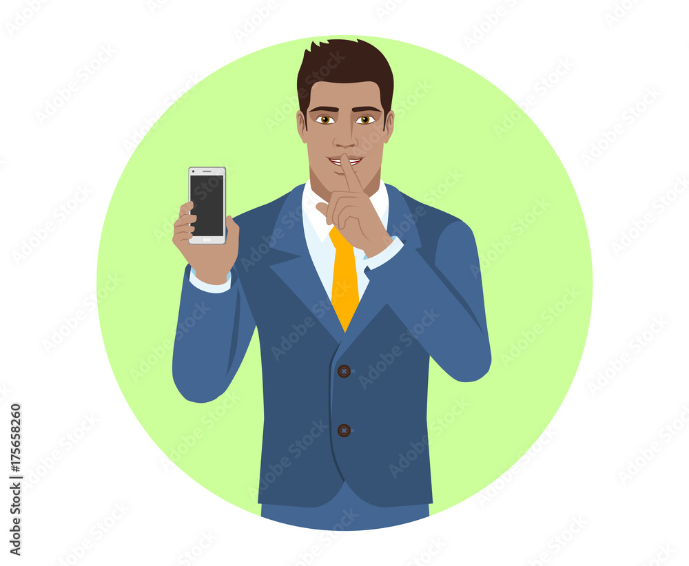 Hush hush. Businessman holding mobile phone and shows hush-hush sign