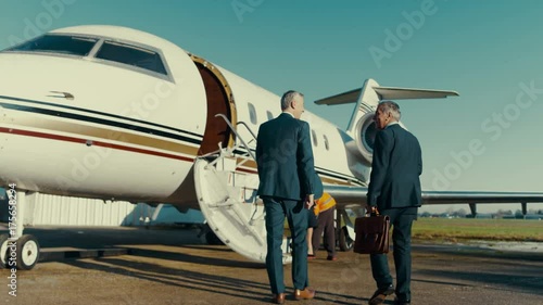  Mixed ethnicity VIP Businessmen boarding private jet photo