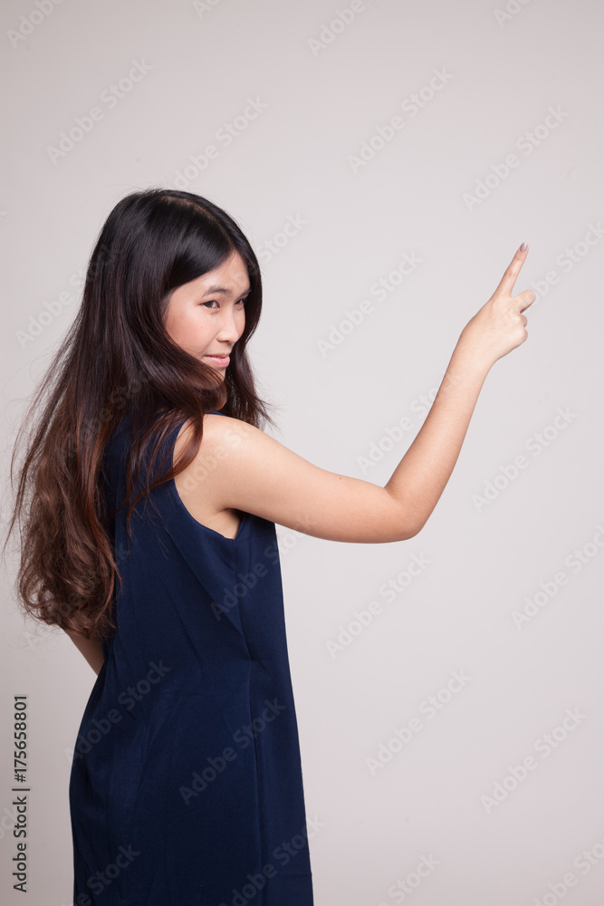 Back of Asian woman touching the screen with her finger. Back of Asian woman touching the screen with her finger.