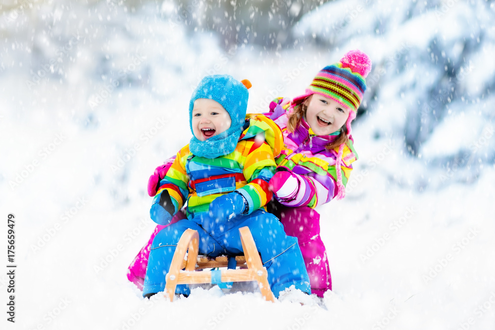 Kids on sleigh ride. Children sledding. Winter snow fun. Kids on sleigh ride. Children sledding. Winter snow fun.