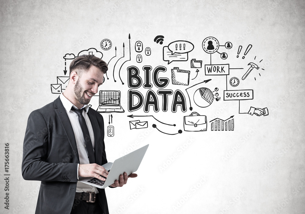 Smiling businessman with a laptop, big data