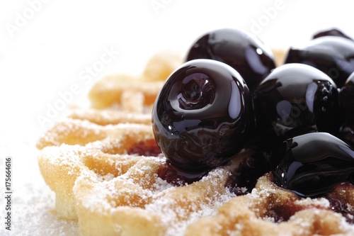 Waffle topped with amarena cherries photo