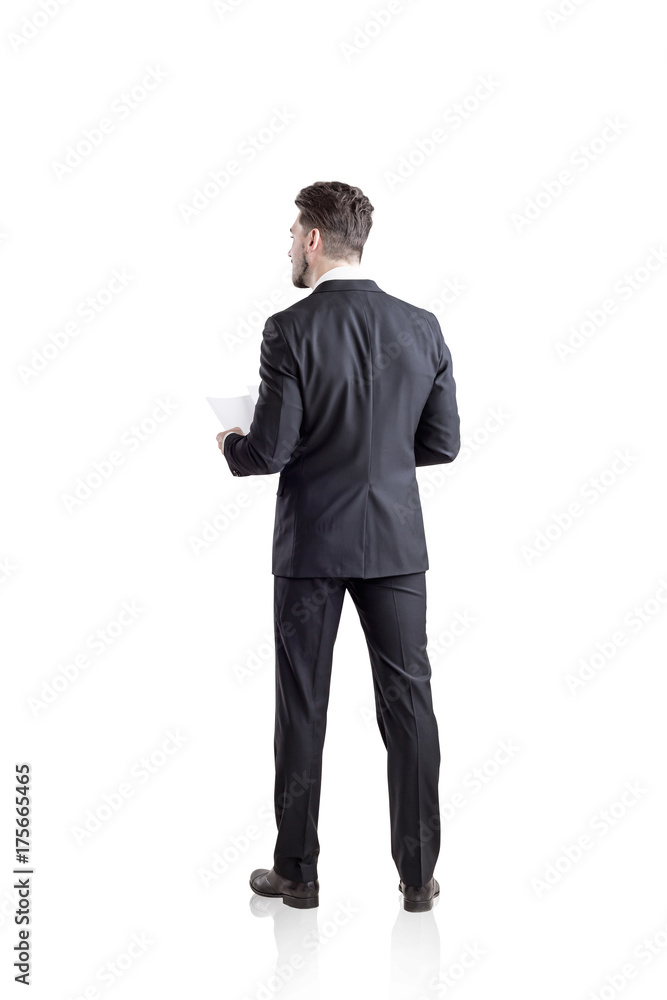 Businessman with a document, rear view, isolated Businessman with a document, rear view, isolated