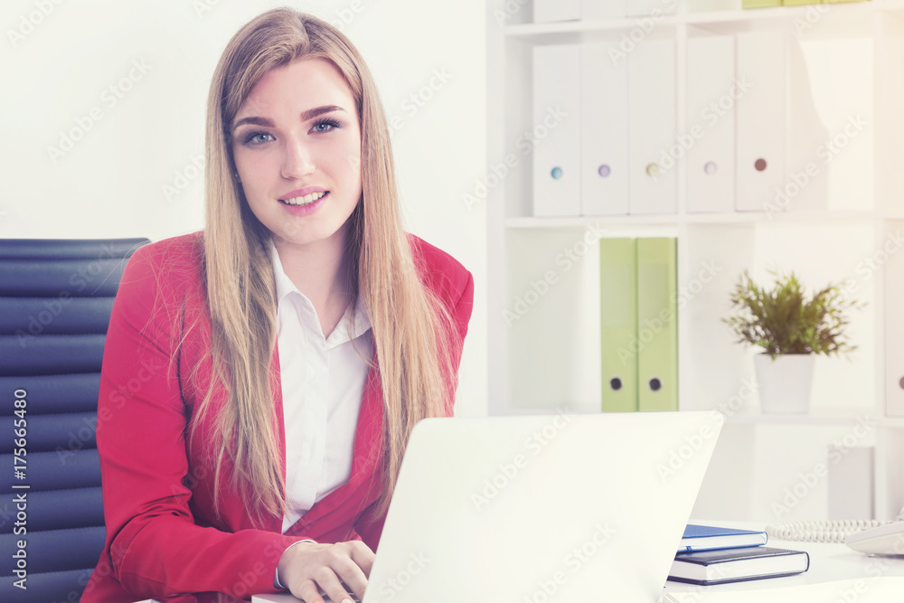 Blonde real estate agent in office Blonde real estate agent in office
