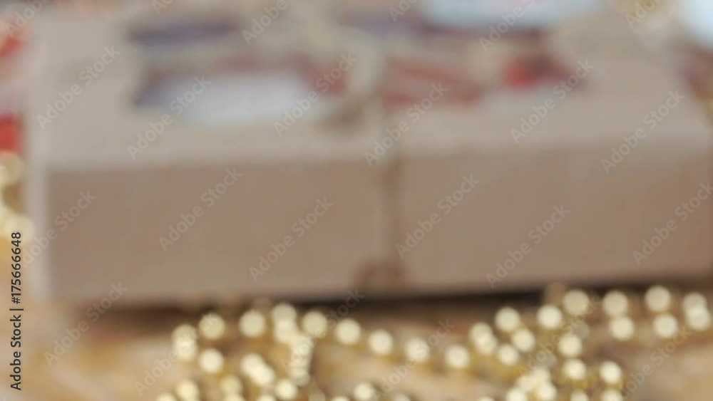 Close-up - Christmas dessert - cookies in colored glaze next to yellow beads Close-up - Christmas dessert - cookies in colored glaze next to yellow beads