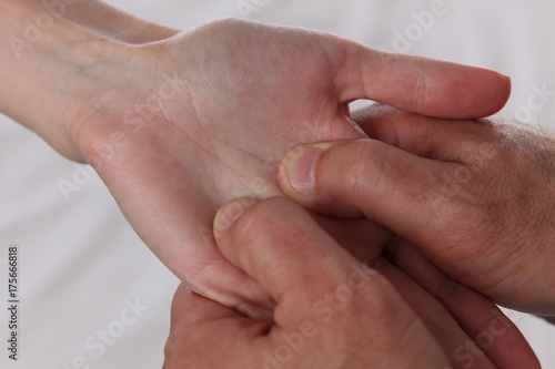 Acupressure. Therapist doing healing treatment on patient's hand . Alternative medicine concept