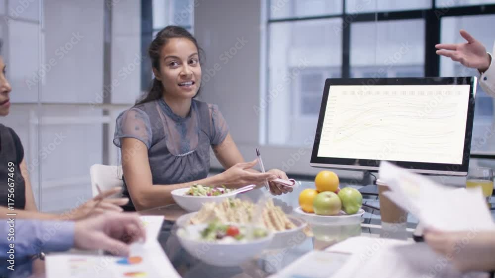 Corporate business team in early morning meeting with food & refreshments Corporate business team in early morning meeting with food & refreshments