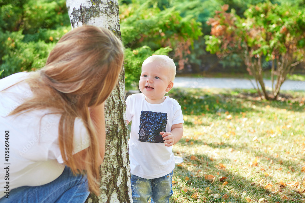 Fototapeta premium Happy beautiful mother and baby daughter or son