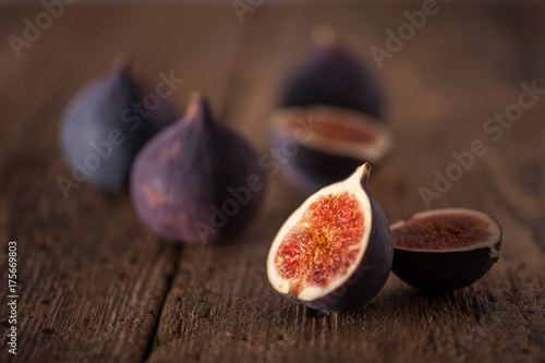 Fresh figues on wooden background photo