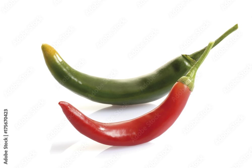 Two peperonis, green and red Two peperonis, green and red