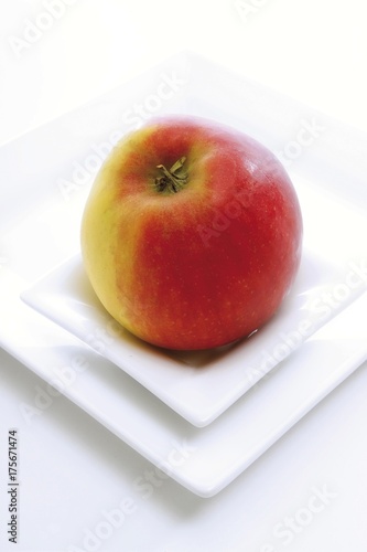 Red apple on a plate