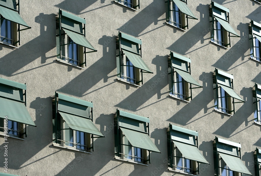 Building facade, shutters on the windows Building facade, shutters on the windows