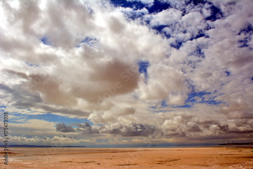 Aegean sea beach with white clouds