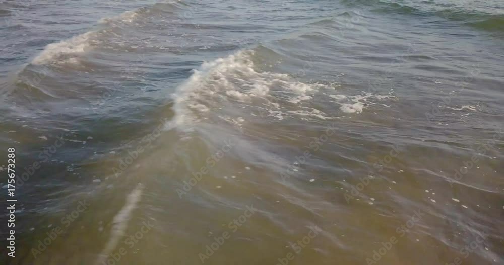 Aerial view of waves crashing on the beach at sunset, Video Shot in Sabaudia, a beautiful beach on the west coast of central Italy. Aerial view of waves crashing on the beach at sunset, Video Shot in Sabaudia, a beautiful beach on the west coast of central Italy.