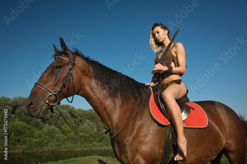 Wild amazon girl on horseback