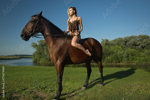Wild amazon girl on horseback