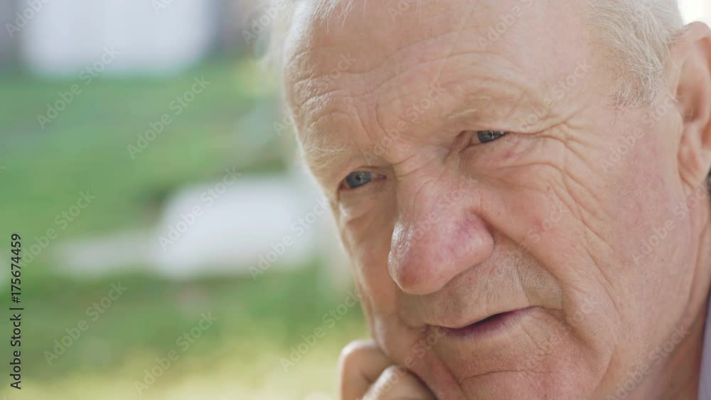 Close-up portrait of lonely thoughtful senior looks at camera 4K Close-up portrait of lonely thoughtful senior looks at camera 4K