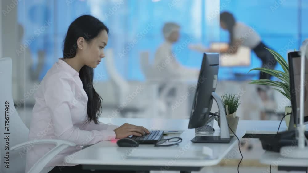 Portrait attractive mature businessman sitting at desk in corporate office Portrait attractive mature businessman sitting at desk in corporate office