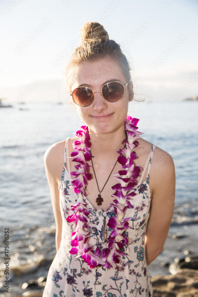 Pretty teenage girl with a Hawaiian lei on a beach vacation Pretty teenage girl with a Hawaiian lei on a beach vacation