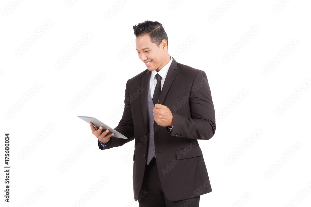 Businessman looking to tablet checking e-mail or shopping online on isolated background. Businessman looking to tablet checking e-mail or shopping online on isolated background.