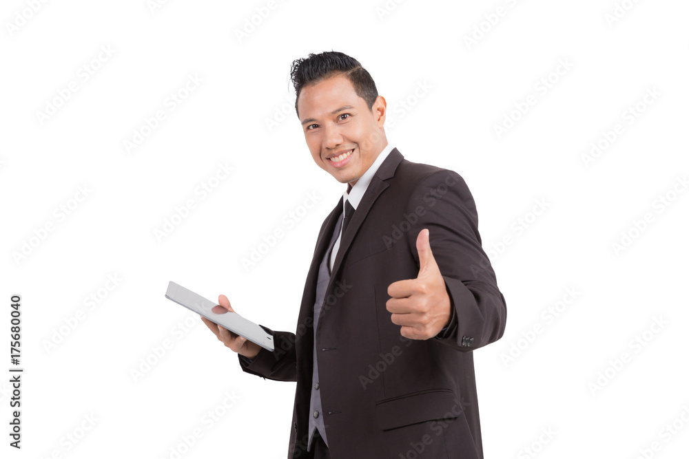 Businessman show thumb finger and tablet on isolated background. Businessman show thumb finger and tablet on isolated background.