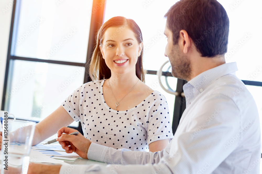 Image of two young business people in office Image of two young business people in office