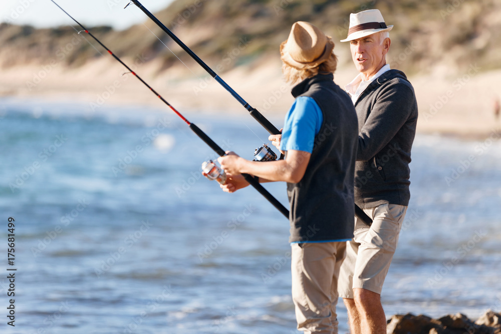 Senior man fishing with his grandson Senior man fishing with his grandson