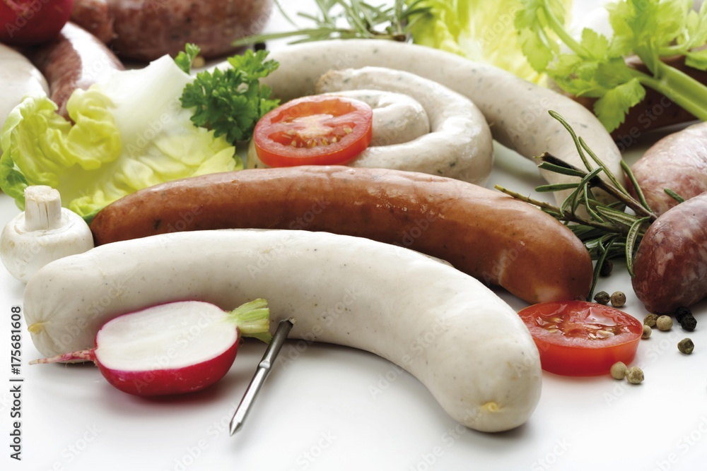 Skewered raw bratwursts, various kinds Skewered raw bratwursts, various kinds