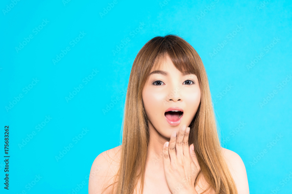 Young Asian woman with surprise pose isolated on blue background. Young Asian woman with surprise pose isolated on blue background.