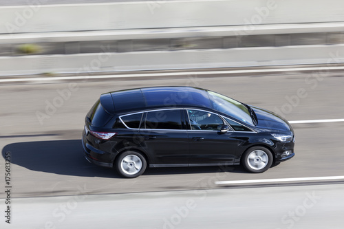 Canvas Print Black van on the road