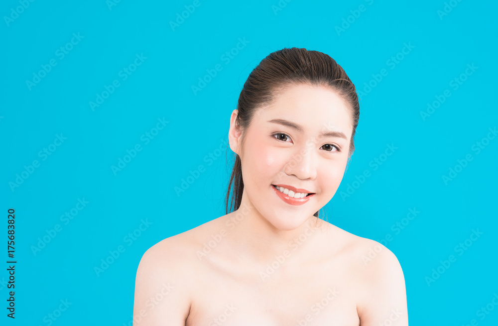 Young Asian woman with happy smile isolated on blue background. Young Asian woman with happy smile isolated on blue background.