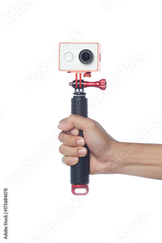 A hand is holding a camera action isolated with white background