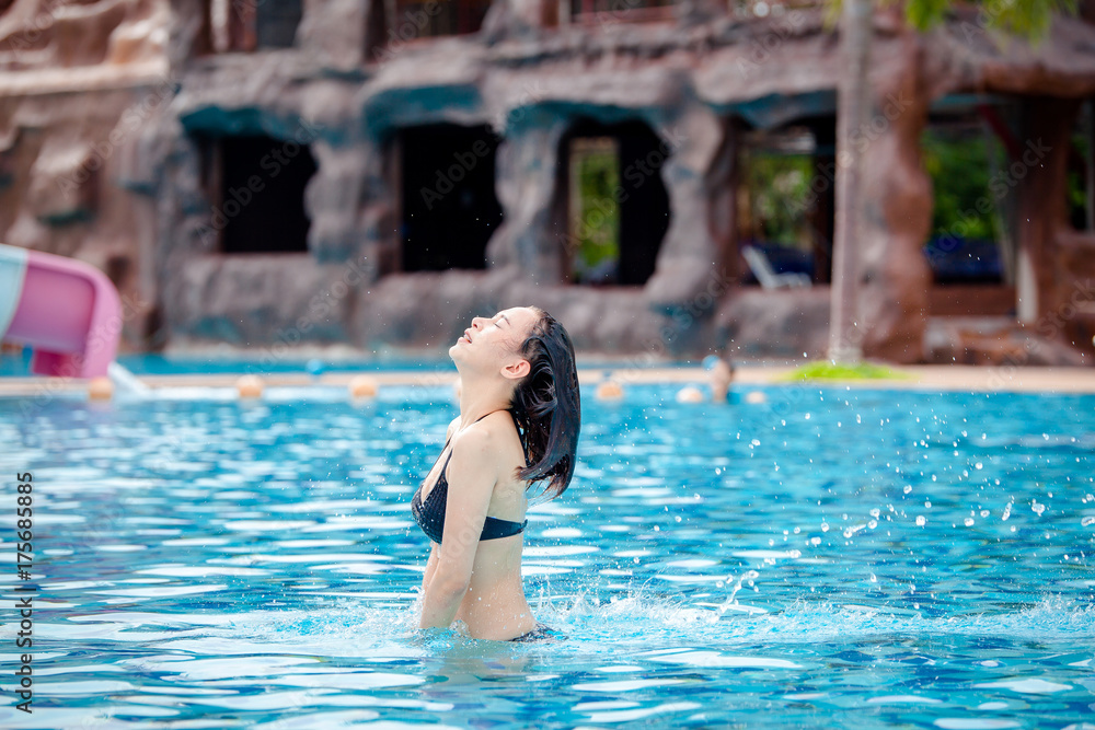 Young woman in the swimming pool,woman asia thailand