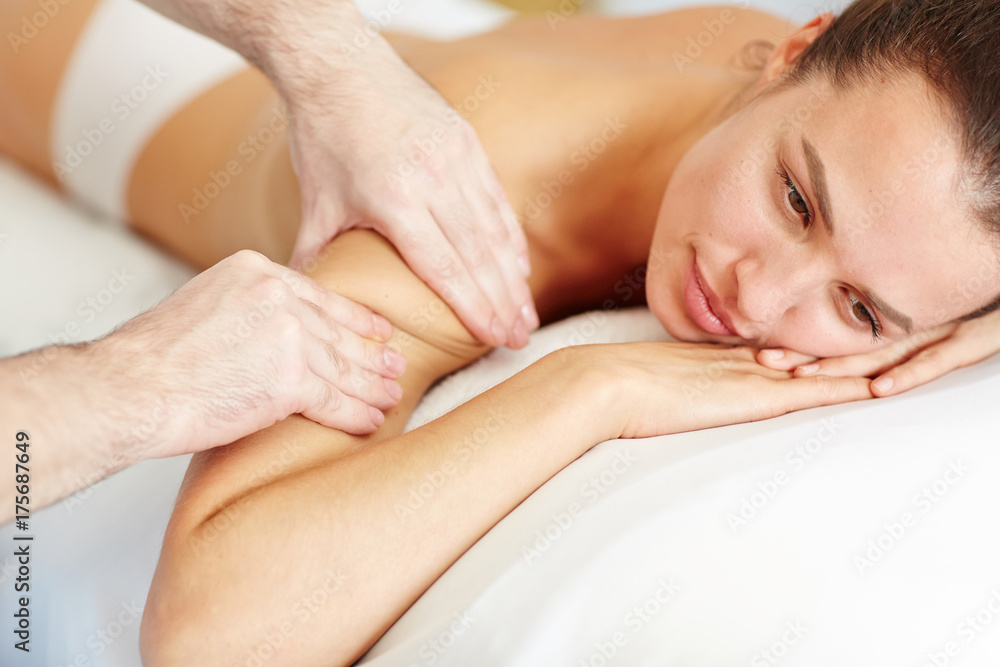 Relaxed female enjoying professional body massage in spa salon Relaxed female enjoying professional body massage in spa salon
