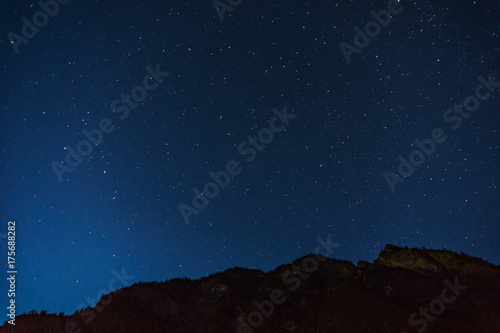 Many starts on blue dark night sky as a cosmos background. © olegmayorov